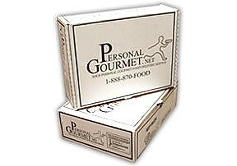 A closed Personal Gourmet shipping box stacked on a second box, as your order arrives